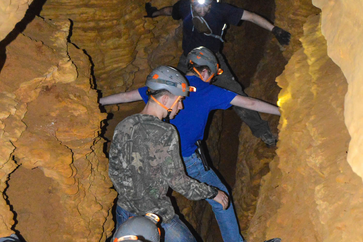 guests crawling through cave