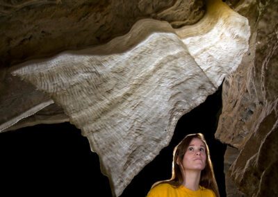 girl looking at cave formations
