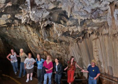 people looking at cave ceiling