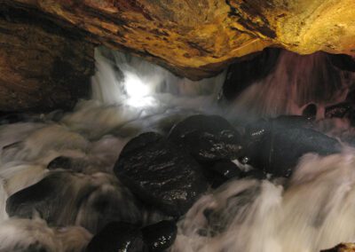 water flowing through cave