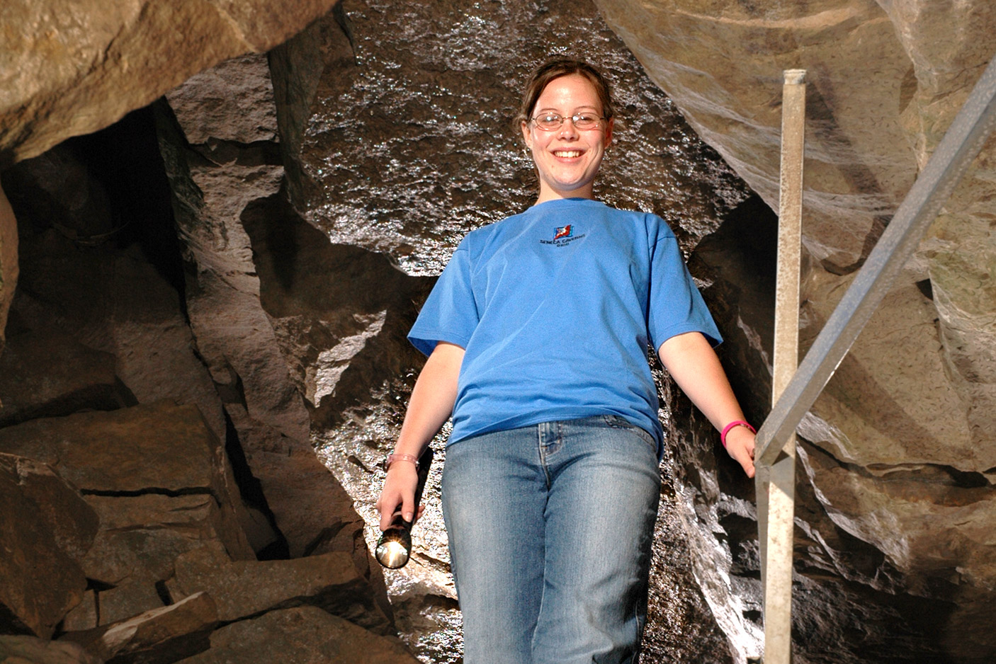girl standing in cave