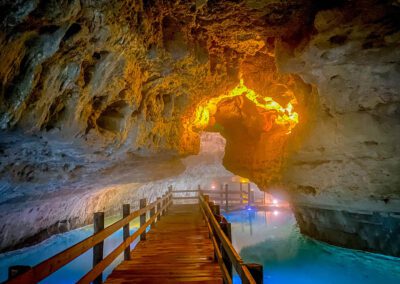 walkway through the cave with water on sides