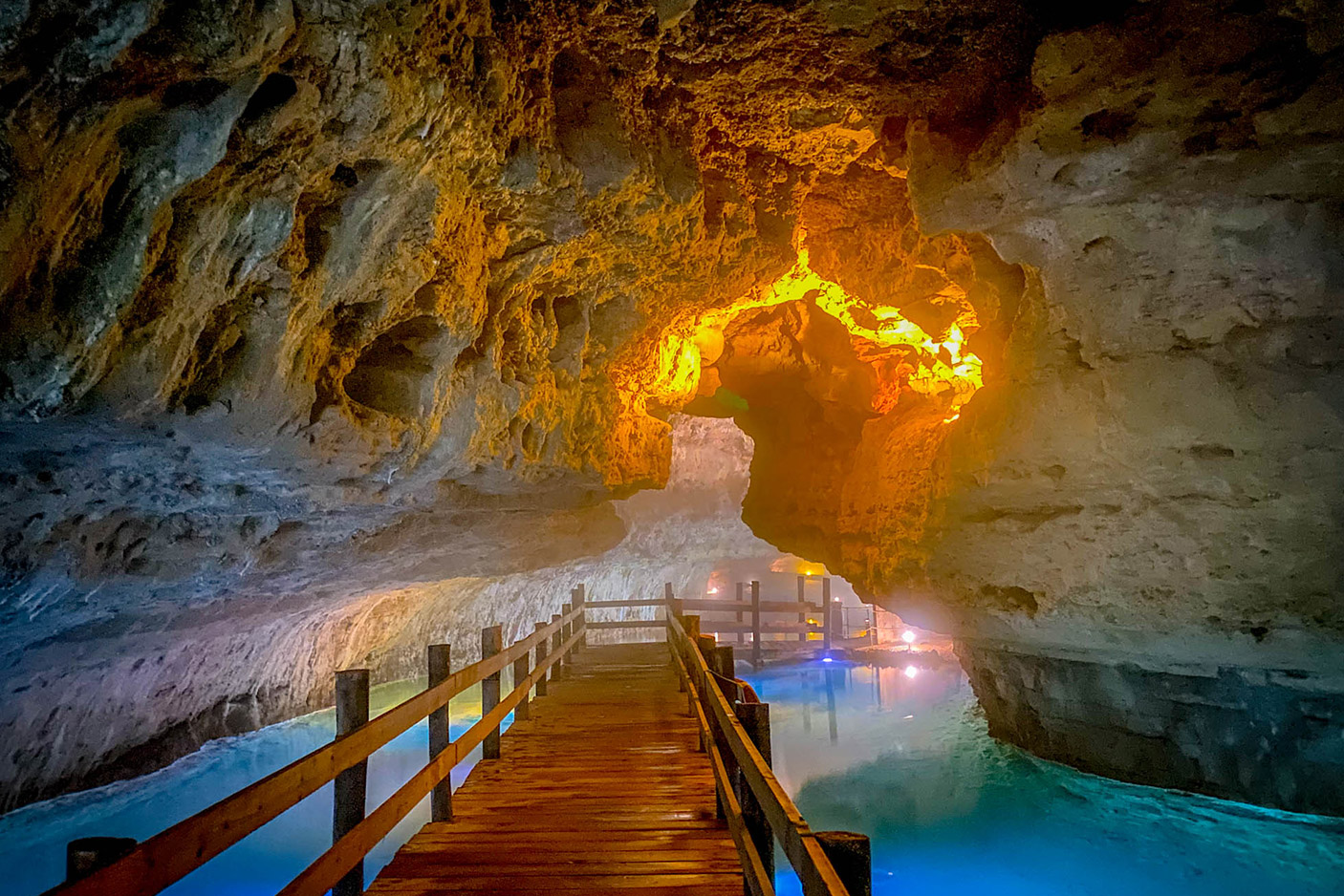 walkway through the cave with water on sides