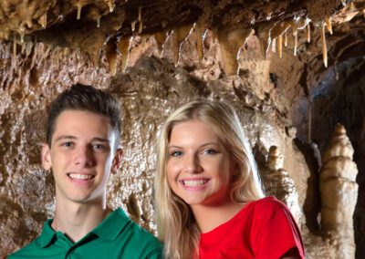 young couple inside a cave